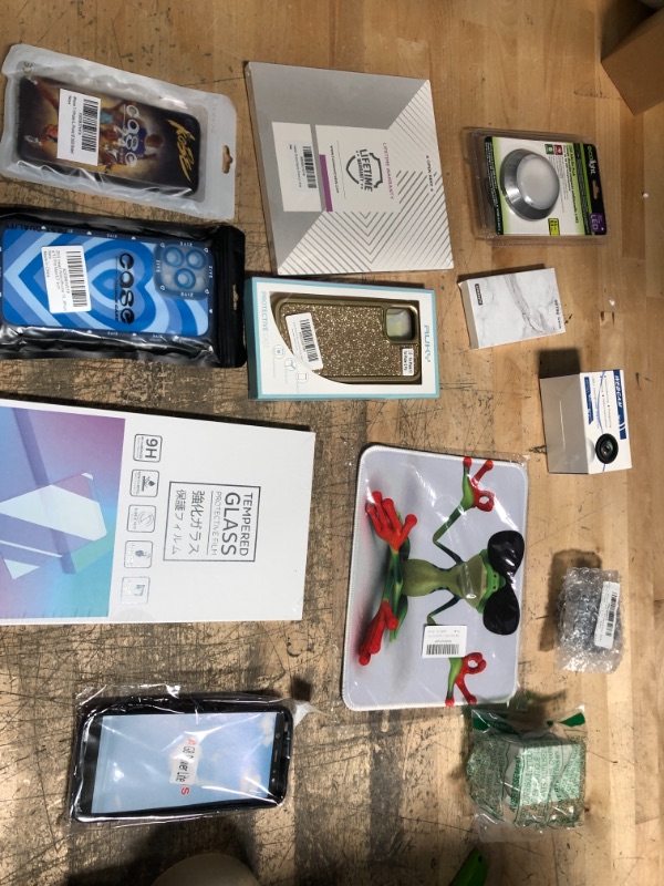 Photo 1 of Assorted Amazon Phone Bundle- 12/13 cases and SCreen Protectors, Mini Cooper Screen Protector, Watch Accessories, and Mouse Pad 
