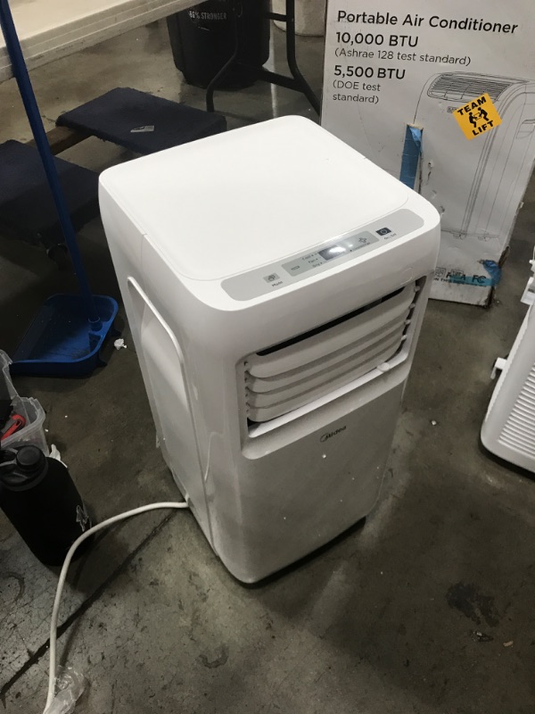Photo 1 of Midea 8,000 BTU ASHRAE (5,300 BTU SACC) Portable Air Conditioner, Cools up to 175 Sq. Ft., Works as Dehumidifier & Fan, Remote Control & Window Kit Included

