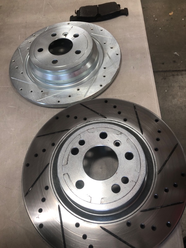 Photo 2 of **MINOR WARE** MISC SET OF DRILLED AND SLOTTED ROTORS 13IN DIFFERENT UNITS
