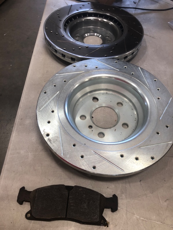 Photo 1 of **MINOR WARE** MISC SET OF DRILLED AND SLOTTED ROTORS 13IN DIFFERENT UNITS