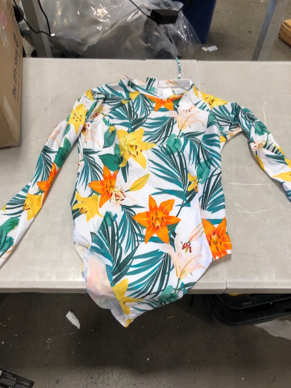 Photo 4 of 2 item bundle 
Ainsley Tropical Long Sleeve One Piece Swimsuit
size medium 
Erica Floral And Tropical Long Sleeve One Piece Swimsuit
size large 