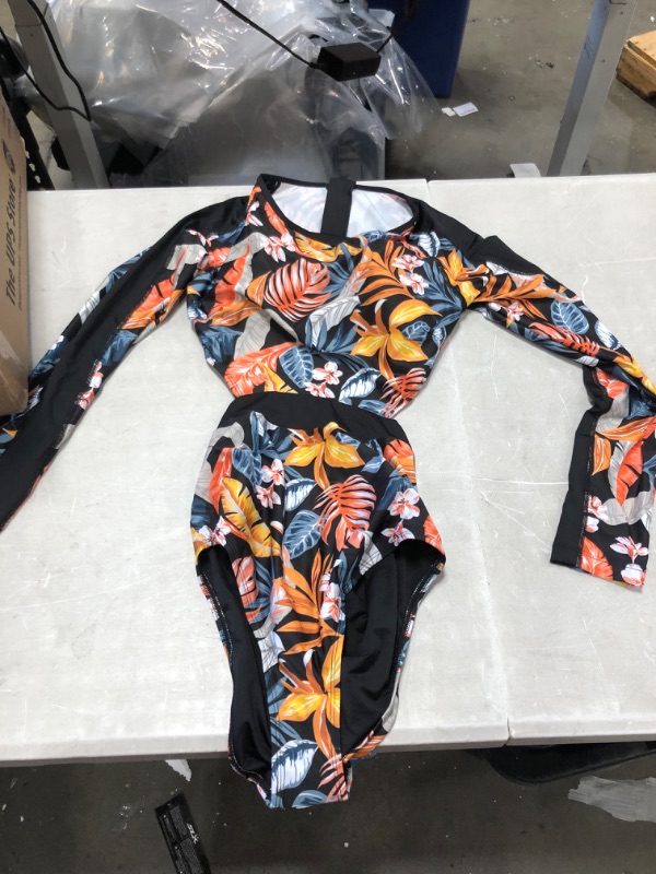 Photo 1 of 2 item bundle 
Ainsley Tropical Long Sleeve One Piece Swimsuit
size medium 
Erica Floral And Tropical Long Sleeve One Piece Swimsuit
size large 