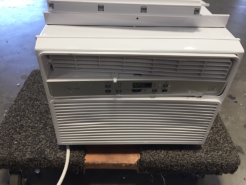 Photo 2 of *Severe Damage*
Midea 12,000 BTU EasyCool Window Air Conditioner, Dehumidifier and Fan - Cool, Circulate and Dehumidify up to 550 Sq. Ft., Reusable Filter, Remote Control
