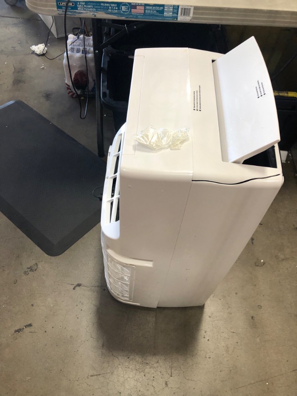 Photo 4 of PARTS ONLY COMPRESSOR NOT COMING ON 
Honeywell (White) Classic Portable Air Conditioner with Dehumidifier & Fan, Cools Rooms Up to 700 Sq. Ft. with Drain Pan & Insulation Tape, MN4CFSWW9, 29.400