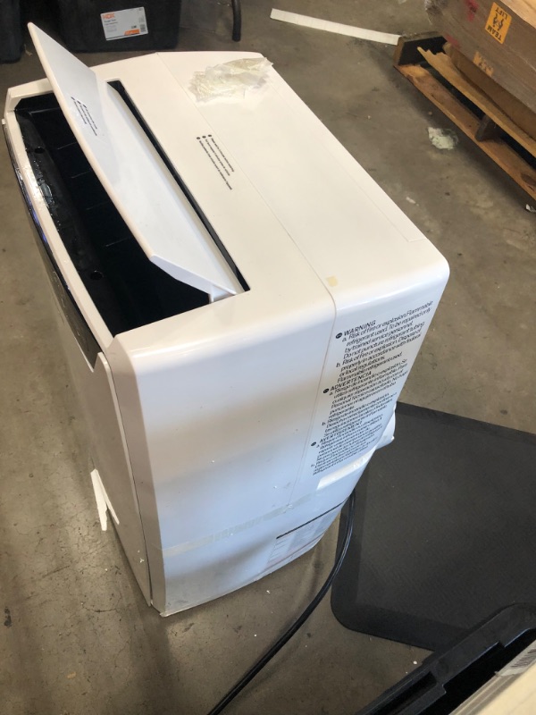 Photo 3 of PARTS ONLY COMPRESSOR NOT COMING ON 
Honeywell (White) Classic Portable Air Conditioner with Dehumidifier & Fan, Cools Rooms Up to 700 Sq. Ft. with Drain Pan & Insulation Tape, MN4CFSWW9, 29.400