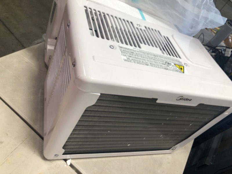 Photo 5 of Midea 12,000 BTU U-Shaped Smart Inverter Window Air Conditioner–Cools up to 550 Sq. Ft., Ultra Quiet with Open Window Flexibility, Works with Alexa/Google Assistant, 35% Energy Savings, Remote Control
Product Dimensions	19.17 x 21.97 x 13.46 inches