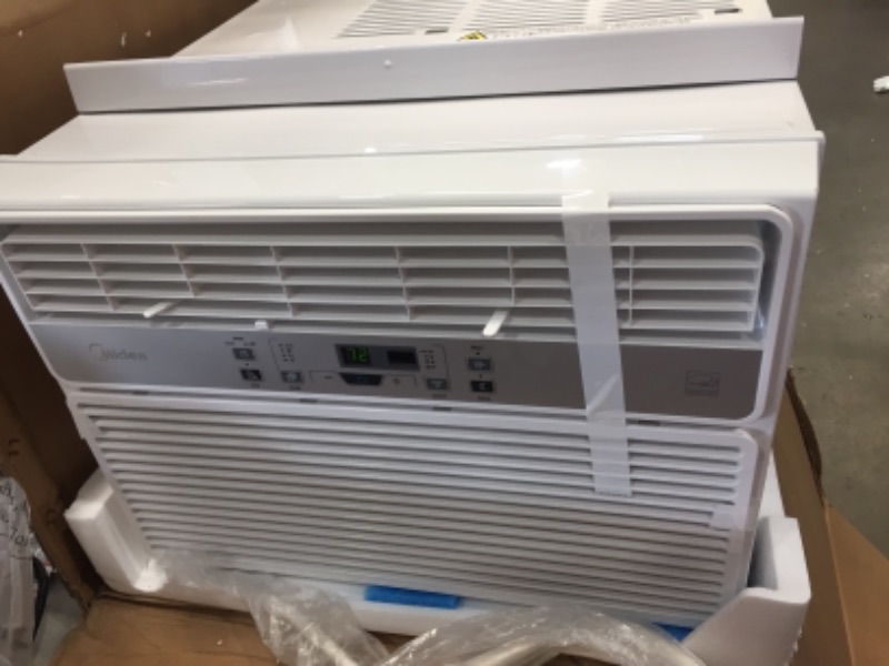 Photo 2 of **MINOR BENDS** Midea 12,000 BTU EasyCool Window Air Conditioner, Dehumidifier and Fan - Cool, Circulate and Dehumidify up to 550 Sq. Ft., Reusable Filter, Remote Control
