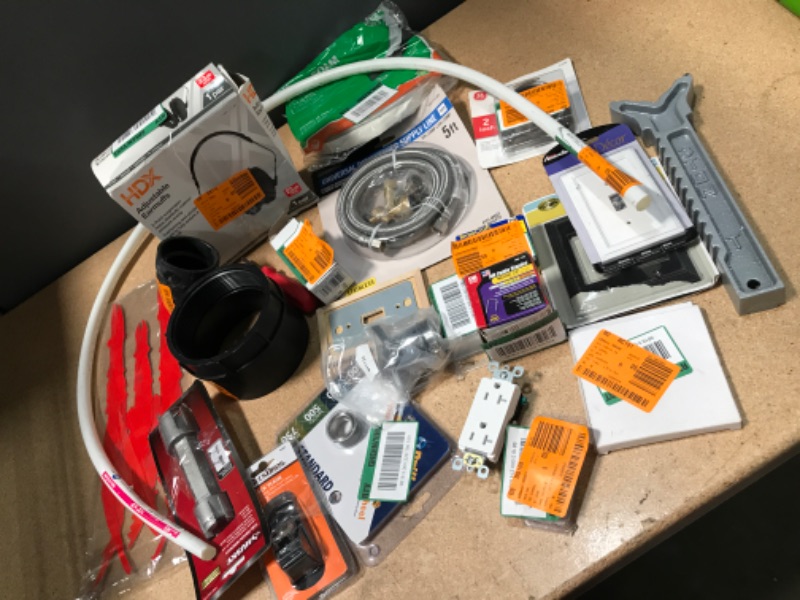 Photo 1 of BUNDLE OF HOME DEPOT GOODS  MISCELLANEOUS ITEMS NON REFUNDABLE 
includes: hardware, pipes, dishwasher supply line, decor, block plane and more 