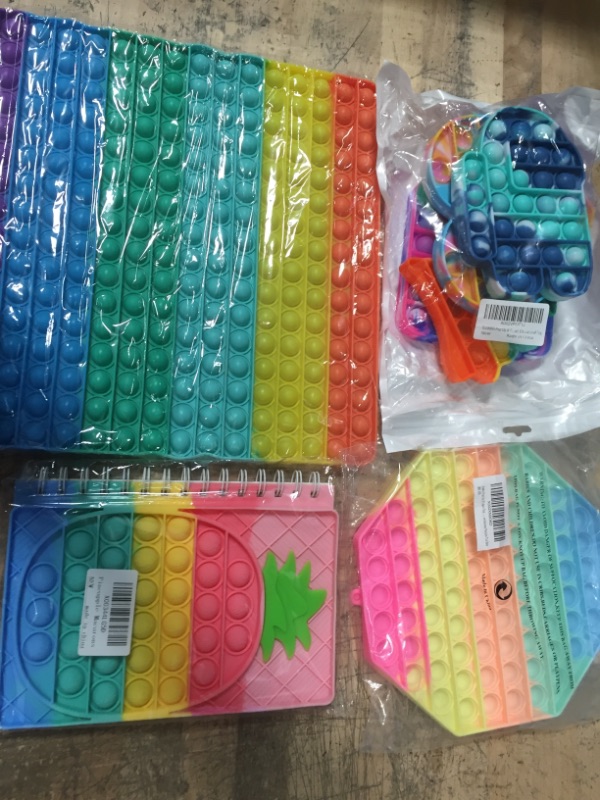 Photo 1 of assorted pop it toy bundle- 4 items 