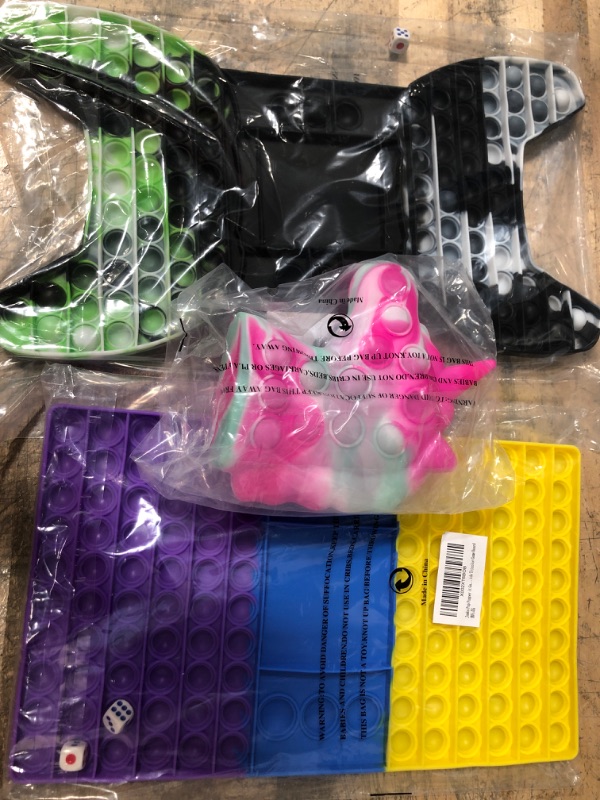 Photo 1 of pop it toy bundle- 3 items