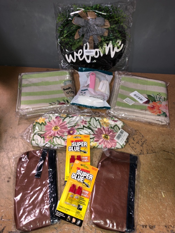 Photo 1 of *BUNDLE OF HOME GOODS-PILLOW CASE, CLOTHING DUST REMOVER, FLOWER TABLE RUNNER, CASH SAVING WALLET, SUPER GLUE, FRONT DOOR WELCOM SIGN*