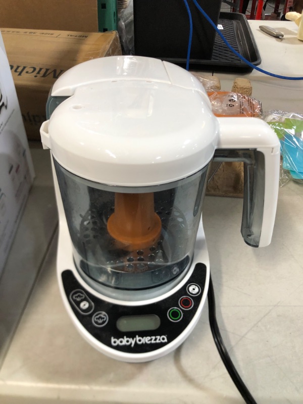 Photo 1 of Baby Brezza One Step Baby Food Maker Deluxe – Cooker and Blender in One to Steam and Puree Baby Food for Pouches - Make Organic Food for Infants and Toddlers - Set Includes 3 Pouches and 3 Funnels