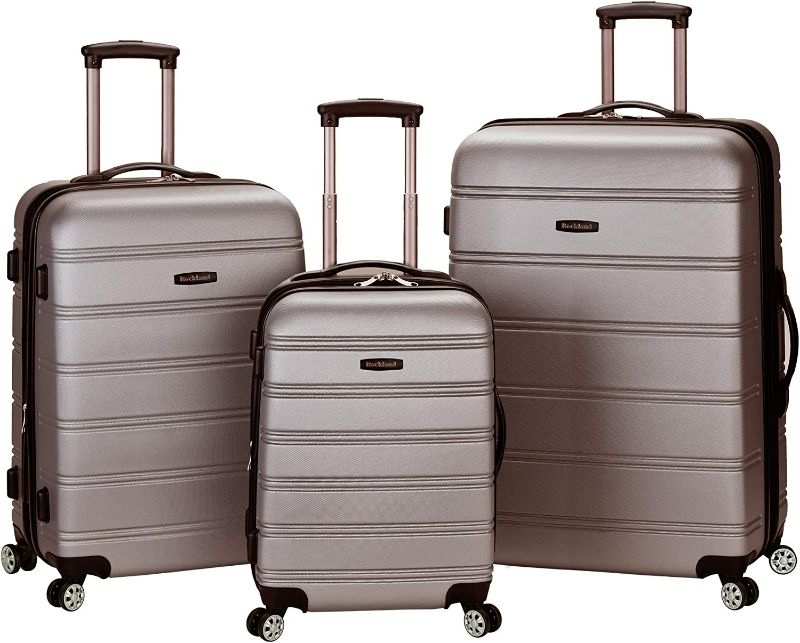 Photo 1 of (USED) Rockland Melbourne Hardside Expandable Spinner Wheel Luggage, Silver, 3-Piece Set (20/24/28)