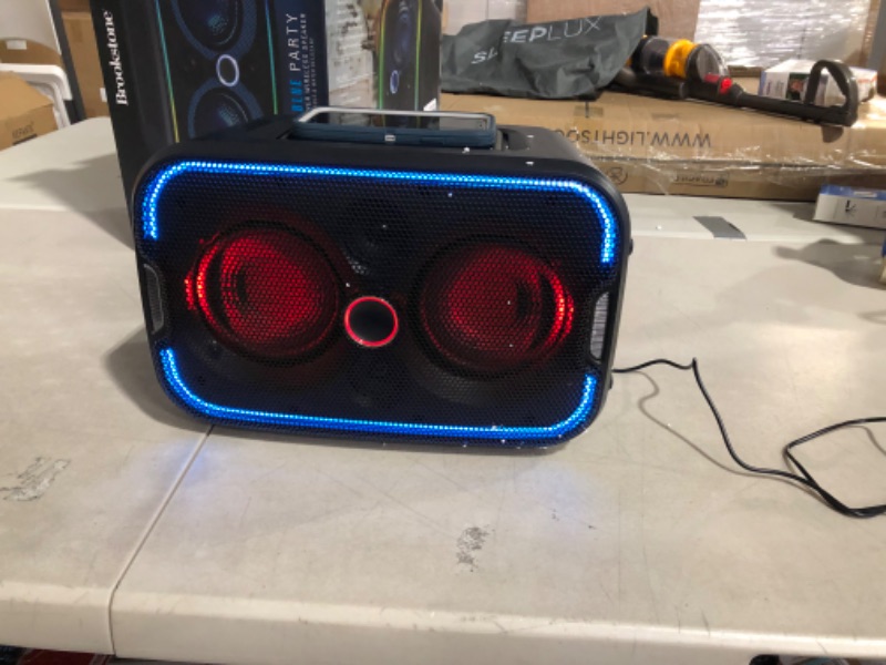 Photo 3 of Brookstone Big Blue Go 60 Watt Wireless Indoor Outdoor Portable Speaker, Built in Qi Charging Pad, LED Light Show, Bluetooth 5.0, IPX5 Water Resistant, Tap to Link Multiple Speakers, Karaoke Mic Input