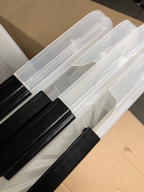 Photo 1 of **SEE NOTES** Sterilite 19909804 116 Quart/110 Liter Ultra Latch Box, Clear with a White Lid and Black Latches, 4-Pack