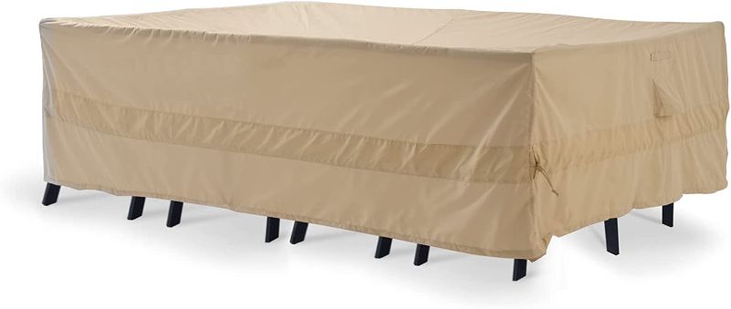 Photo 1 of Kikcoin Rectangular/Oval Patio Table Cover, 100% Waterproof Outdoor Furniture Covers 126"L X 84"W X 28"H