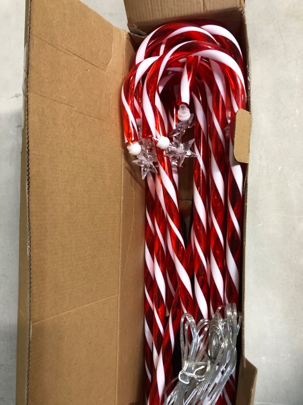 Photo 2 of 28” Candy Cane Lights Outdoor Pathway, 42 Feet in Total Length with 12 Pack Candy Cane Pathway Lights with Shiny Star for Outside Christmas Decorations, 10 LED Lights in Each Light Up Candy Canes 12 Pcs Star