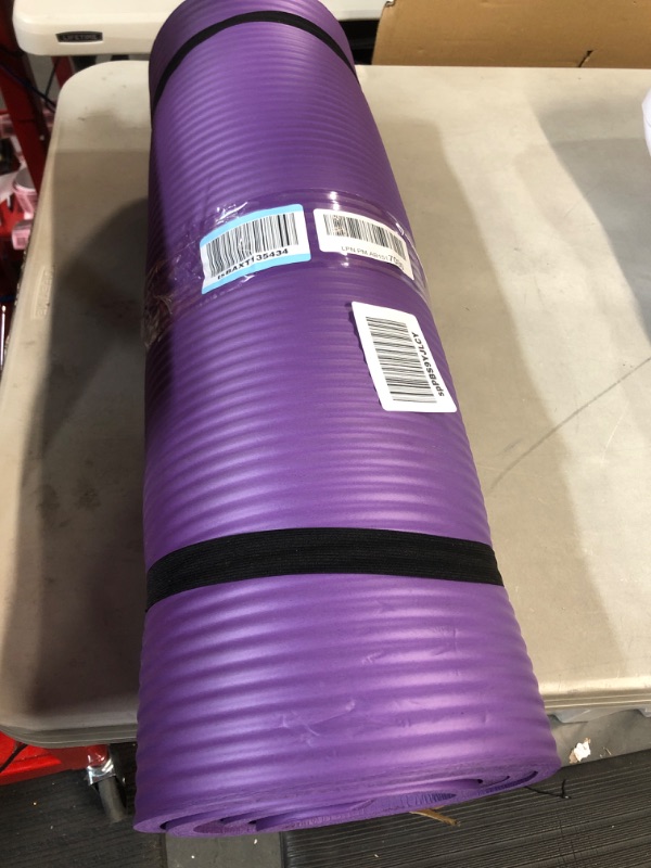 Photo 2 of Amazon Basics Extra Thick Exercise Yoga Gym Floor Mat with Carrying Strap - 74 x 24 x .5 Inches, Purple 
