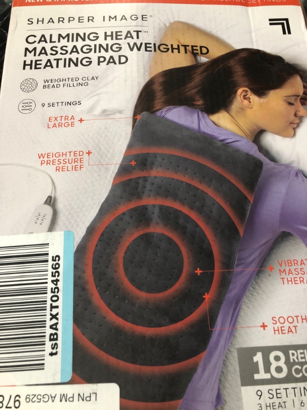 Photo 2 of Calming Heat Massaging Weighted Heating Pad 