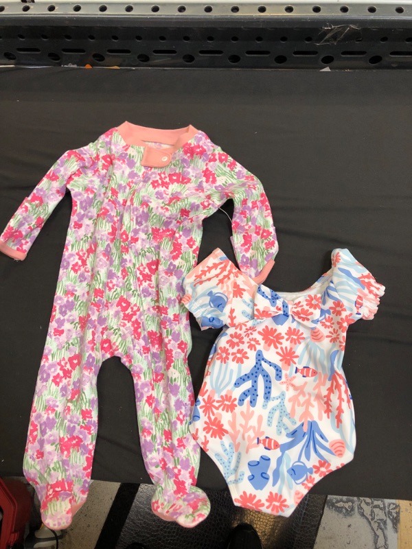 Photo 1 of 2 ITEM COUNT Burt's Bees Baby® Baby Girls' Footed Pajama SIZE 0-3M & SWIMSUIT SIZE 6M