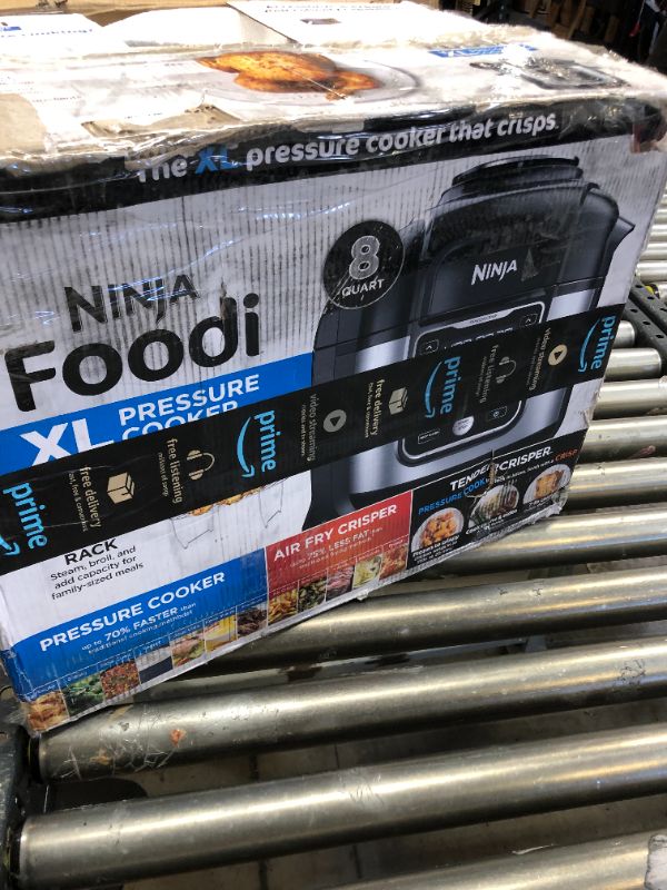 Photo 1 of Ninja OS401 Foodi 10-in-1 XL 8 qt. Pressure Cooker & Air Fryer that Steams, Slow Cooks, Sears, Sautés, Dehydrates & More, with 5.6 qt. Cook & Crisp Plate & 15 Recipe Book, Silver
