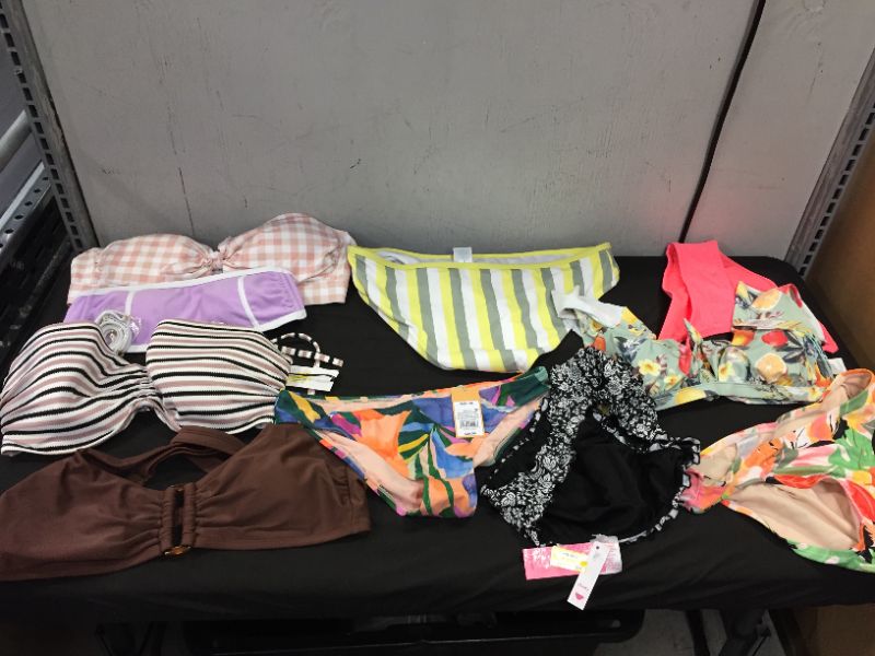 Photo 1 of BAG LOT OF WOMEN'S BIKINI'S DIFFERENT SIZE AND STYLES ---SOLD AS IS ---