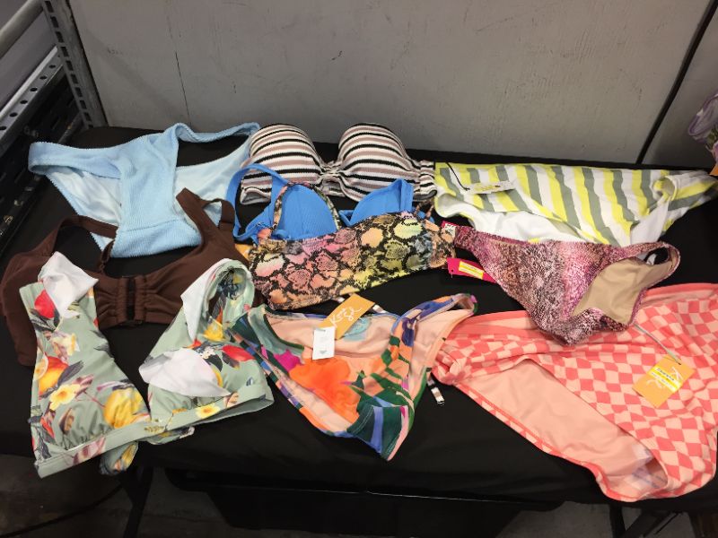 Photo 1 of BAG LOT OF WOMEN'S BIKINI'S DIFFERENT SIZE AND STYLES ---SOLD AS IS ---