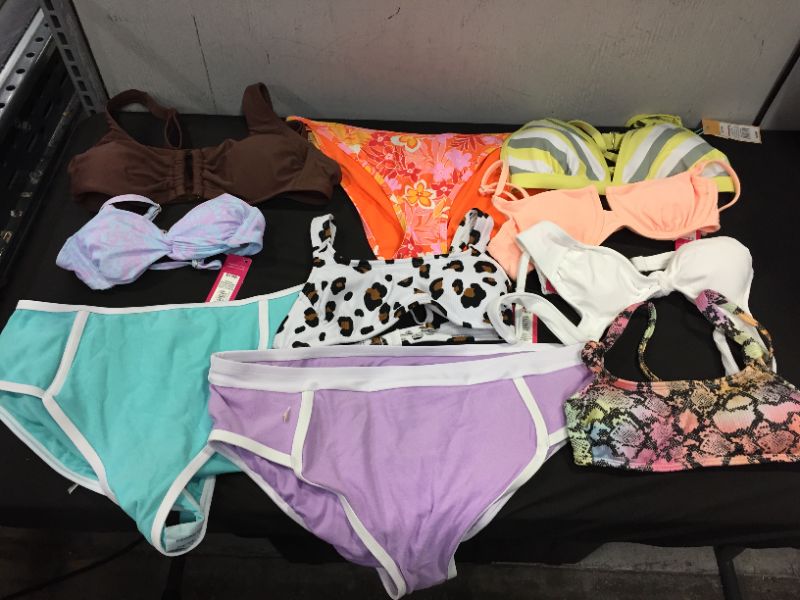 Photo 1 of BAG LOT OF WOMEN'S BIKINI'S DIFFERENT SIZE AND STYLES ---SOLD AS IS ---