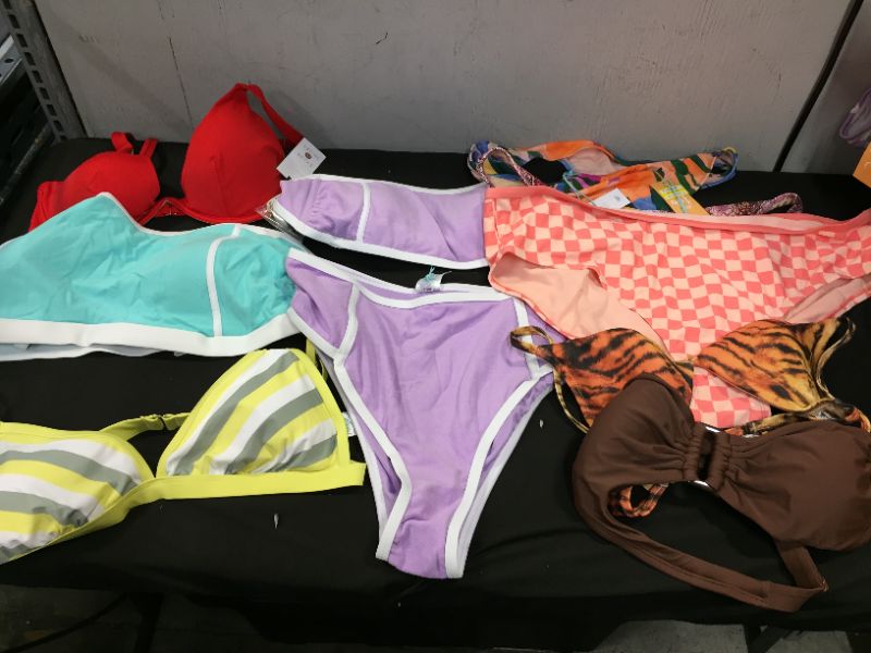 Photo 1 of BAG LOT OF WOMEN'S BIKINI'S DIFFERENT SIZE AND STYLES ---SOLD AS IS ---
