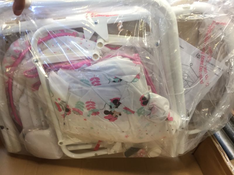 Photo 1 of Delta Children Gliding Bassinet, Minnie Boutique