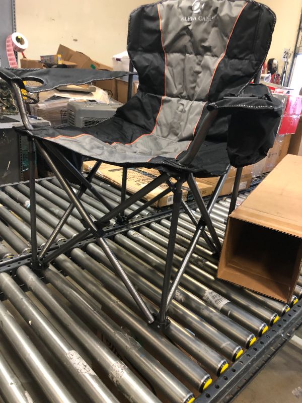 Photo 5 of ALPHA CAMP Oversized Camping Folding Chair Heavy Duty Support 450 LBS Oversized Steel Frame Collapsible Padded Arm Chair with Cup Holder Quad Lumbar Back Chair Portable for Outdoor----there is a torn part on one of the arm rest ---view pictures 