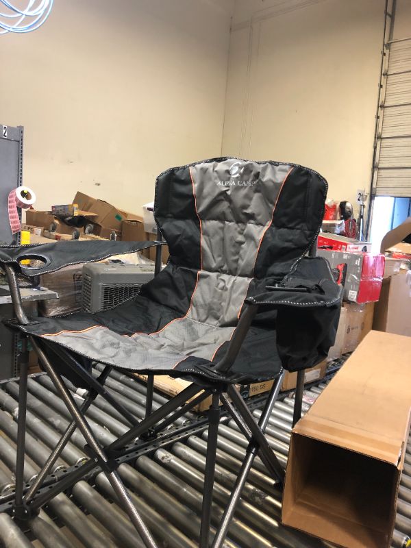 Photo 3 of ALPHA CAMP Oversized Camping Folding Chair Heavy Duty Support 450 LBS Oversized Steel Frame Collapsible Padded Arm Chair with Cup Holder Quad Lumbar Back Chair Portable for Outdoor----there is a torn part on one of the arm rest ---view pictures 