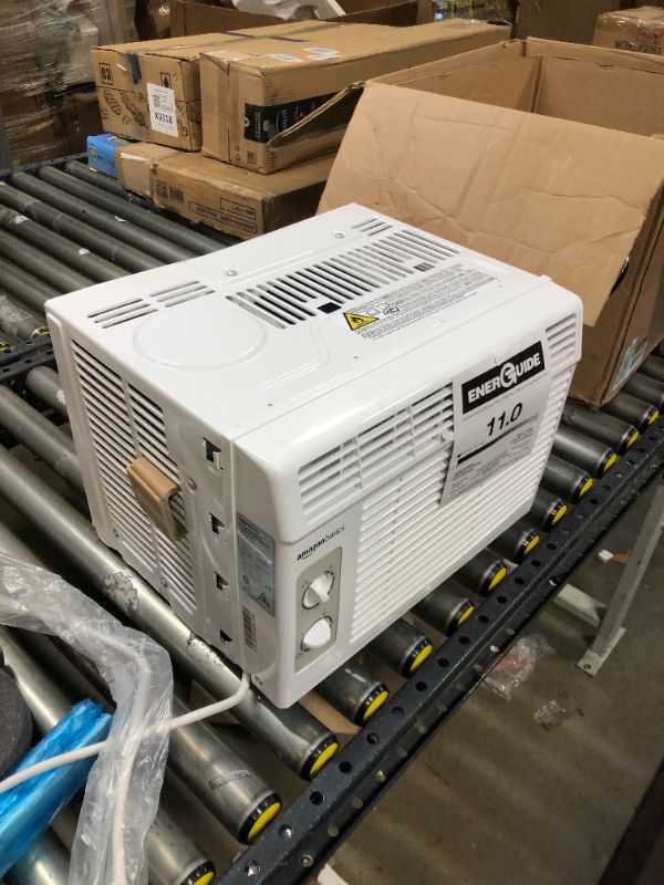 Photo 1 of Amazon Basics Window-Mounted Air Conditioner with Mechanical Control - Cools 150 Square Feet, 5000 BTU, AC Unit