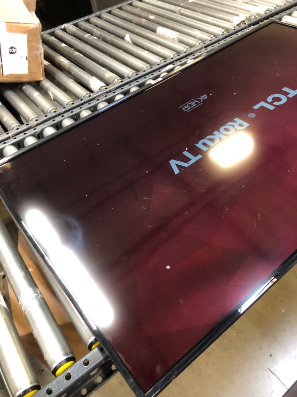 Photo 1 of TCL 55" Class 4-Series 4K UHD HDR Smart Roku TV(Wi-Fi, RF, USB, Ethernet, HDMI) - 55S455----missing everything ---tv only no control -----the screen is dipping in a little 
