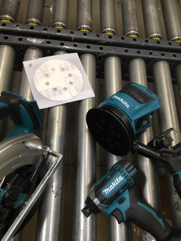 Photo 2 of Makita XT801X1 18V LXT Lithium-Ion Cordless 8-Pc. Combo Kit (3.0Ah)-------98percent of the items are brand new there are some scratches on the skill saw other then that everything is new ----seems like a person used the saw once then returned the item  
