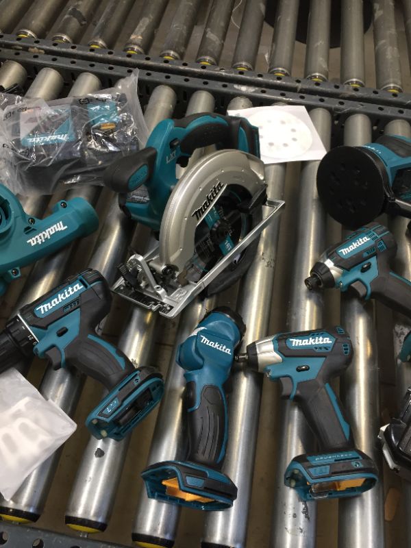 Photo 5 of Makita XT801X1 18V LXT Lithium-Ion Cordless 8-Pc. Combo Kit (3.0Ah)-------98percent of the items are brand new there are some scratches on the skill saw other then that everything is new ----seems like a person used the saw once then returned the item  
