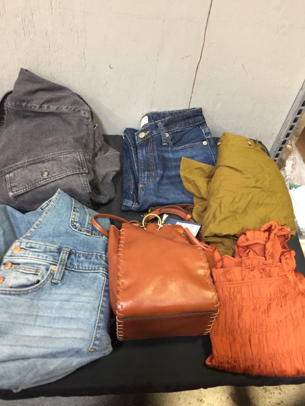 Photo 1 of BAG LOT OF 10 WOMEN CLOTHING ITEMS --DIFFERENT STYLES AND SIZES --SOLD AS IS ---