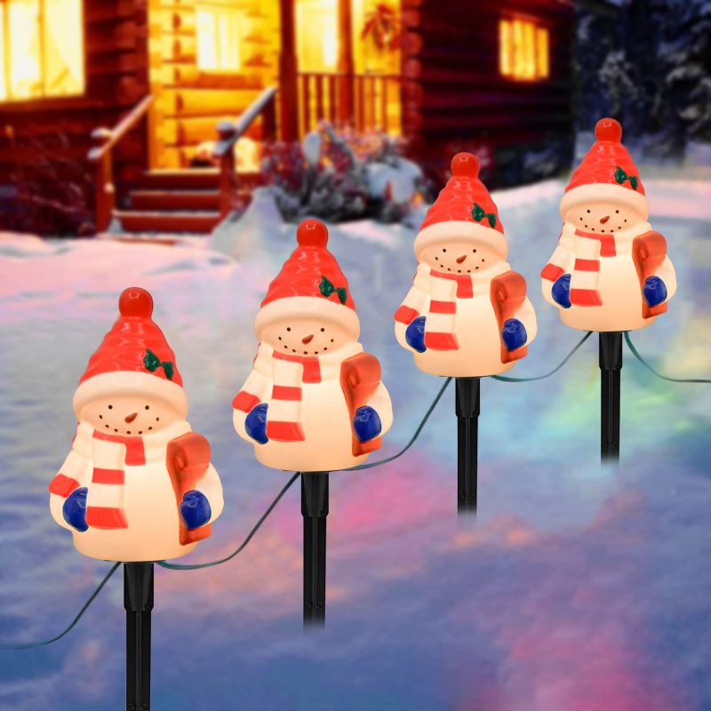 Photo 1 of C7 Christmas Pathway String Lights, 4 Snowman Stake Lights with C7 Clear Bulbs, Connectable Marker Lights for Outdoor Christmas Holiday Lawn Decor Walkway Driveway Lighting, Green Wire