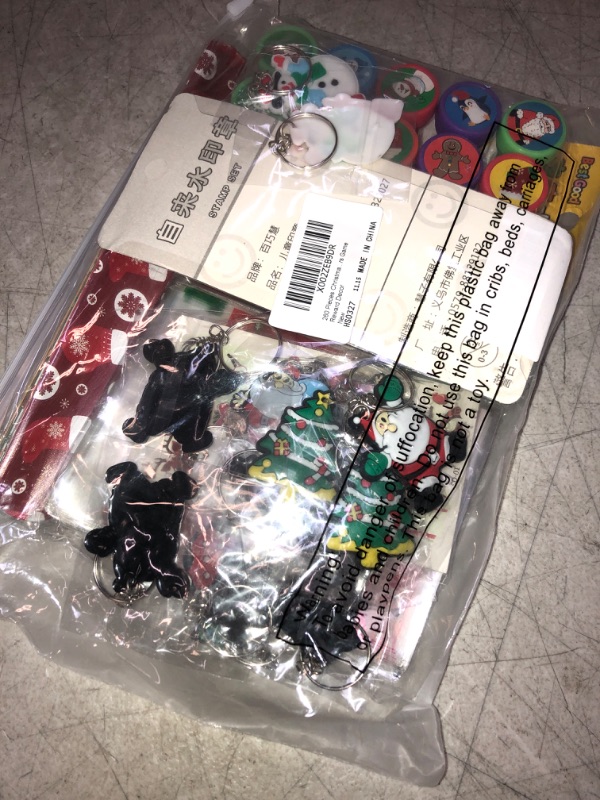 Photo 2 of 260 Pieces Christmas Stocking Stuffers Include 110 Temporary 100 Christmas Candy Bags 20 Christmas Stampers 15 Slap Bracelets 15 Keychains for Christmas Party Favors Game Reward Decor