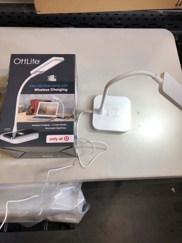 Photo 2 of LED Riley Wireless Charging Desk Lamp - OttLite 9( TESTED ) ( LIGHT COMES ON ) BOX HAS MINOR DAMAGE 

