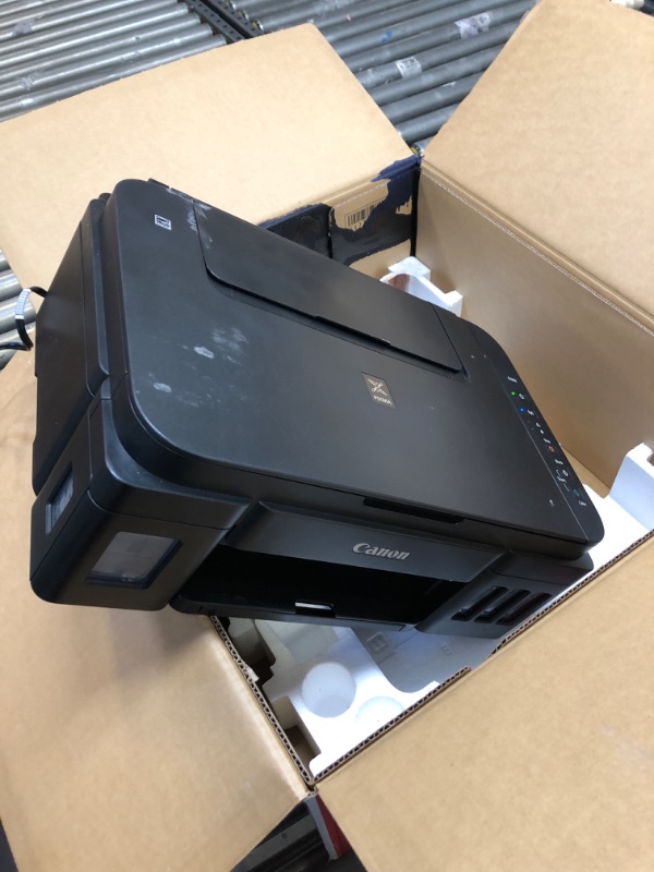 Photo 1 of Canon PIXMA G3260 Wireless MegaTank All-in-One Printer
 - item turns on but unable to test if functional - ink spilled in box 