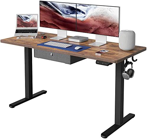 Photo 1 of FEZIBO Standing Desk with Drawer, Adjustable Height Electric Stand up Desk, 55 x 24 Inches Sit Stand Home Office Desk, Ergonomic Workstation Black Steel Frame/Rustic Brown Tabletop
