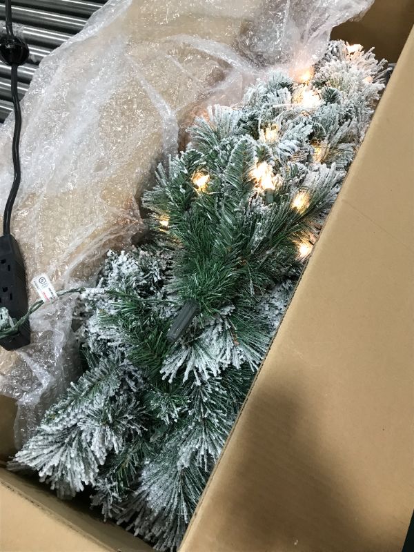 Photo 1 of Puleo International 4.5 Foot Pre-Lit Flocked Portland Pine Pencil Artificial Christmas Tree with 100 UL Listed Clear Lights 4.5' Flocked Pencil Pine with 100 Clear Lights