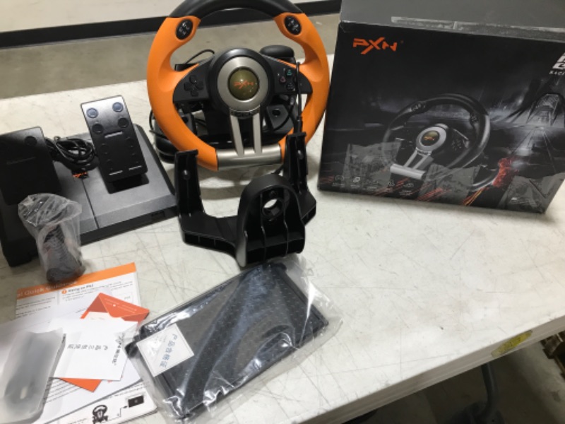 Photo 1 of Game Racing Wheel, PXN-V3II 180° Competition Racing Steering Wheel with Universal USB Port and with Pedal, Suitable for PC, PS3, PS4, Xbox One, Xbox Series S&X, Nintendo Switch - Orange