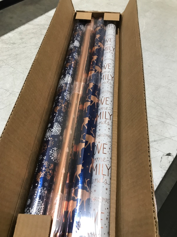 Photo 2 of American Greetings Christmas Reversible Wrapping Paper Bundle, Snowflake, Reindeer, Holiday Text (4 Rolls, 80 sq. ft.) Navy and Rose Gold Wrapping Paper