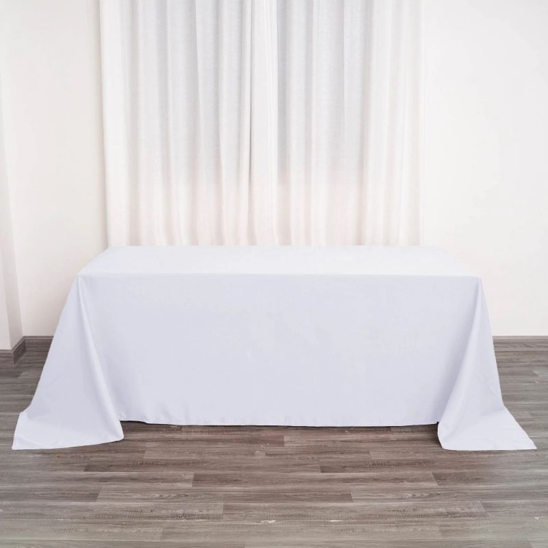 Photo 1 of 90"X132" White Polyester Rectangular Tablecloth