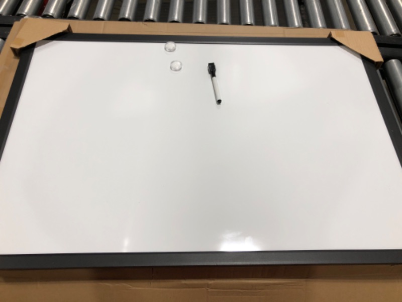 Photo 2 of Amazon Basics Magnetic Dry Erase White Board, 35 x 23-Inch Whiteboard - Black Wooden Frame 23"x35" Magnetic, Wood Frame