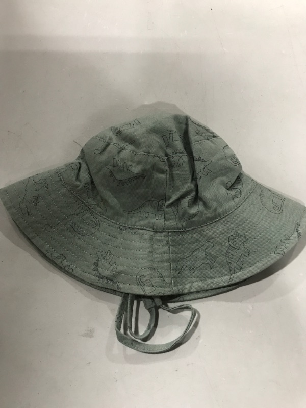 Photo 1 of BABY BOY DINOSAUR BUCKET SUNHAT 
SIZE 6-8 MONTHS 