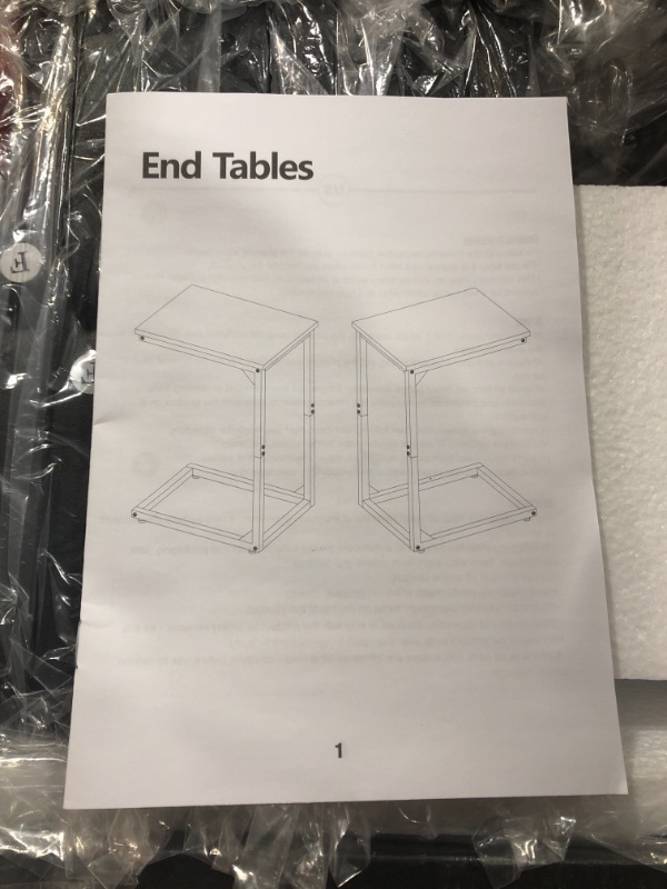 Photo 1 of 2 black end tables unknown dimensions or brand