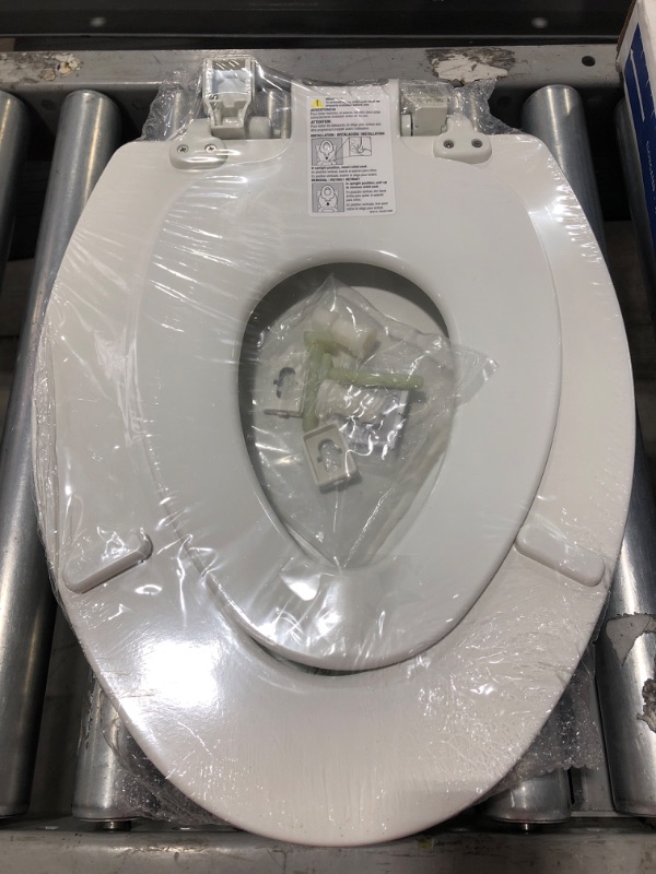 Photo 4 of BEMIS NextStep2 Children's Potty Training Elongated Closed Front Enameled Wood Toilet Seat in White with Plastic Child Seat. 
